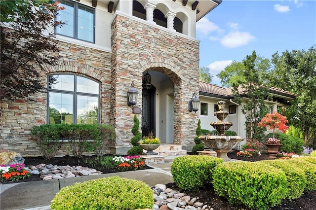 11110 W 146th Ter, Overland Park, KS 66221 - doorway to property with stucco siding and stone siding