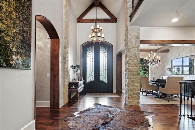 11110 W 146th Ter, Overland Park, KS 66221 - foyer featuring a chandelier, arched walkways, beam ceiling, and wood finished floors