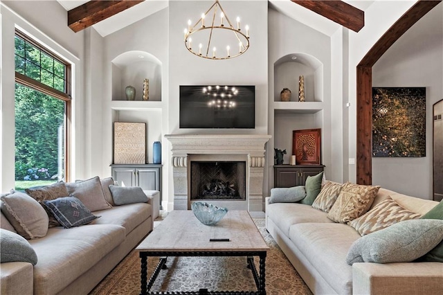 11110 W 146th Ter, Overland Park, KS 66221 - living area featuring built in features, a chandelier, beam ceiling, a premium fireplace, and high vaulted ceiling