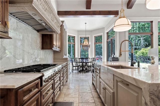 11110 W 146th Ter, Overland Park, KS 66221 - kitchen featuring premium range hood, stone tile flooring, decorative backsplash, stainless steel gas cooktop, and light stone countertops