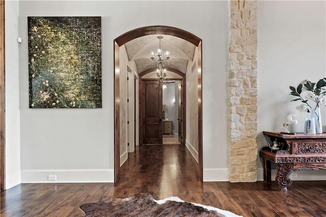 11110 W 146th Ter, Overland Park, KS 66221 - hallway featuring arched walkways, a chandelier, and wood finished floors