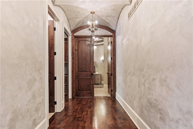 11110 W 146th Ter, Overland Park, KS 66221 - hall with arched walkways, wood-type flooring, lofted ceiling, and a chandelier