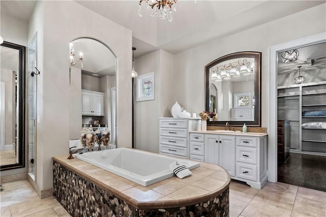 11110 W 146th Ter, Overland Park, KS 66221 - full bath with a chandelier, vanity, a garden tub, and plenty of natural light