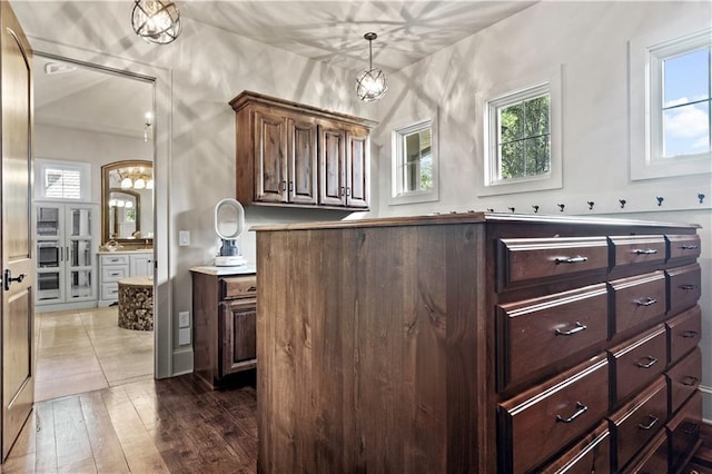 11110 W 146th Ter, Overland Park, KS 66221 - bathroom with plenty of natural light, wood finished floors, and a chandelier