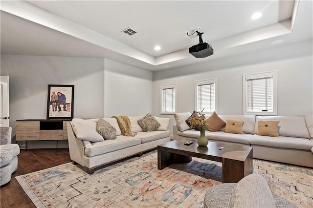 11110 W 146th Ter, Overland Park, KS 66221 - living room featuring a raised ceiling, wood finished floors, and recessed lighting