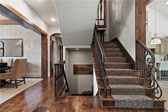 11110 W 146th Ter, Overland Park, KS 66221 - stairway with arched walkways, wood finished floors, and recessed lighting