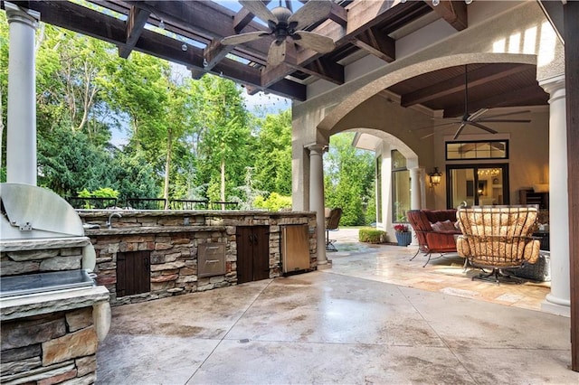 11110 W 146th Ter, Overland Park, KS 66221 - view of patio with area for grilling, a ceiling fan, and view of wooded area