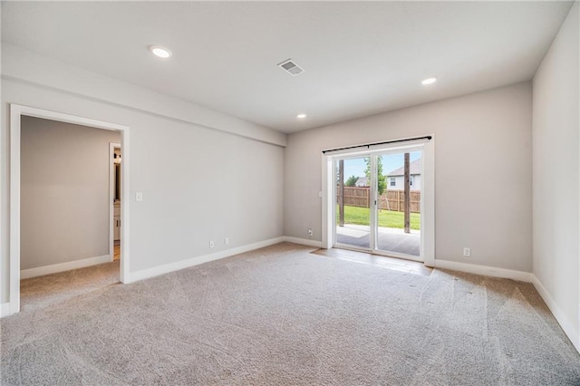 901 NW Hickorywood Dr, Grain Valley, MO 64029 - spare room featuring light carpet and recessed lighting