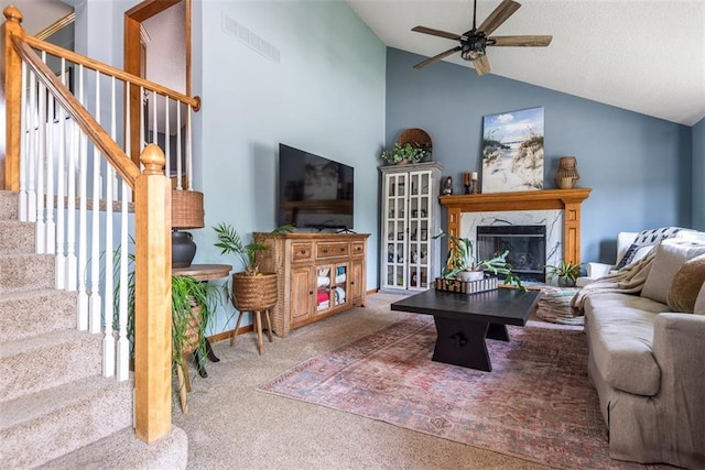 190 W Colleen Ct, Gardner, KS 66030 - living room with carpet flooring, lofted ceiling, ceiling fan, stairway, and a fireplace