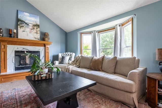 190 W Colleen Ct, Gardner, KS 66030 - living room featuring vaulted ceiling, a premium fireplace, and a textured ceiling