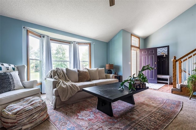 190 W Colleen Ct, Gardner, KS 66030 - living room with vaulted ceiling, a textured ceiling, and stairway