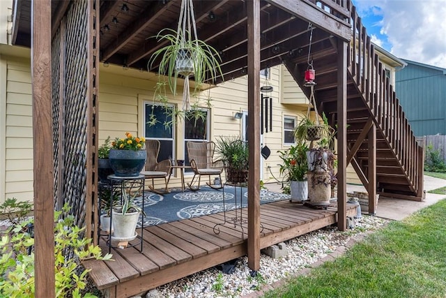 190 W Colleen Ct, Gardner, KS 66030 - wooden deck with stairway and a patio area