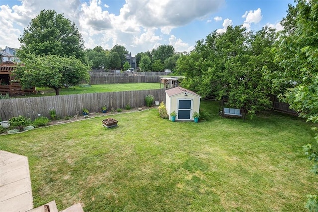 190 W Colleen Ct, Gardner, KS 66030 - fenced backyard with a storage unit and an outdoor fire pit