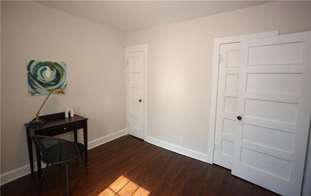1034 E Lexington Ave, Independence, MO 64050 - bedroom with dark wood finished floors and baseboards
