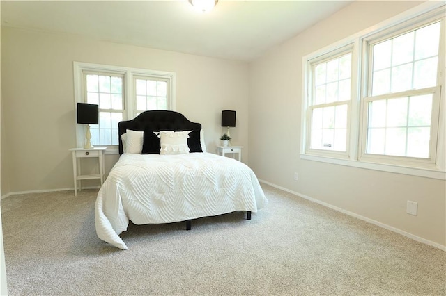 1034 E Lexington Ave, Independence, MO 64050 - carpeted bedroom with baseboards
