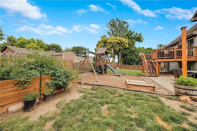 257 NE Chateau Dr, Blue Springs, MO 64014 - fenced backyard featuring a wooden deck, stairs, and a playground