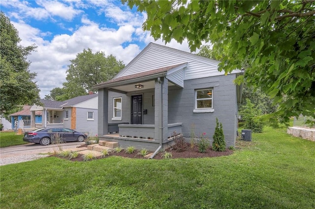 41 S 26th St, Kansas City, KS 66102 - view of front of property with a front yard and a porch