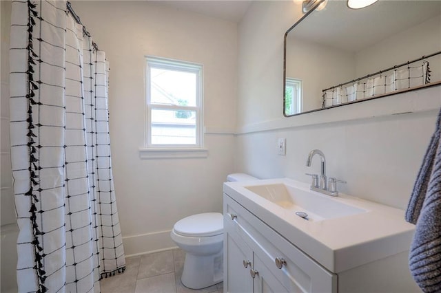 41 S 26th St, Kansas City, KS 66102 - bathroom with plenty of natural light, vanity, tile patterned flooring, and curtained shower