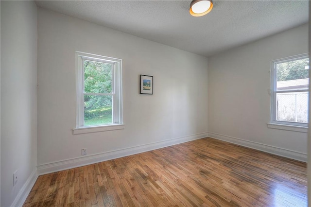 41 S 26th St, Kansas City, KS 66102 - empty room with wood finished floors and baseboards