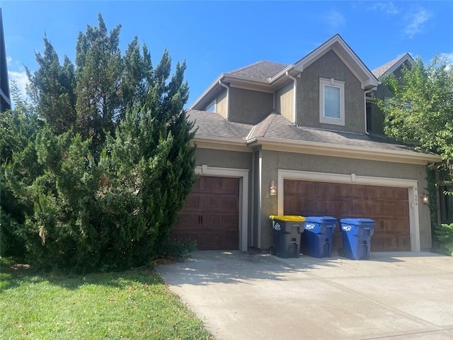 404 Eagles Ridge Dr, Blue Springs, MO 64014 - view of front facade featuring stucco siding, concrete driveway, a garage, and roof with shingles