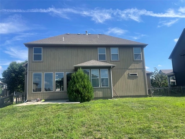 404 Eagles Ridge Dr, Blue Springs, MO 64014 - back of property with roof with shingles and a patio area