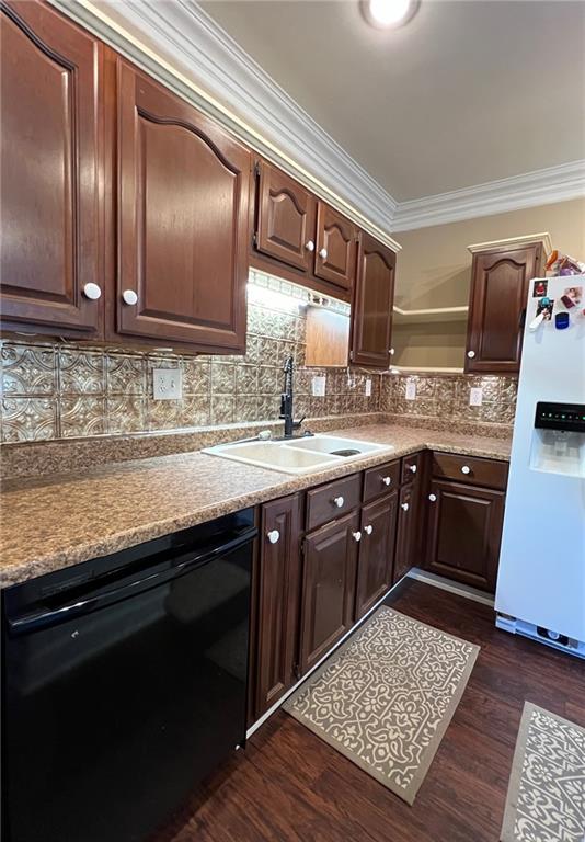 233 Main St, Osawatomie, KS 66064 - kitchen featuring black dishwasher, white fridge with ice dispenser, open shelves, crown molding, and backsplash