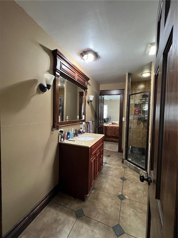 233 Main St, Osawatomie, KS 66064 - full bathroom with vanity, a shower stall, tile patterned flooring, and ensuite bath