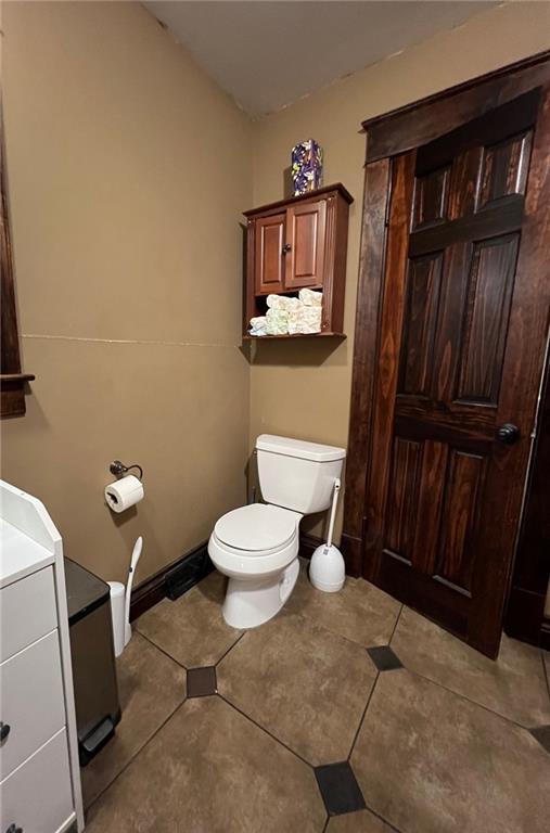 233 Main St, Osawatomie, KS 66064 - bathroom featuring vanity and tile patterned floors