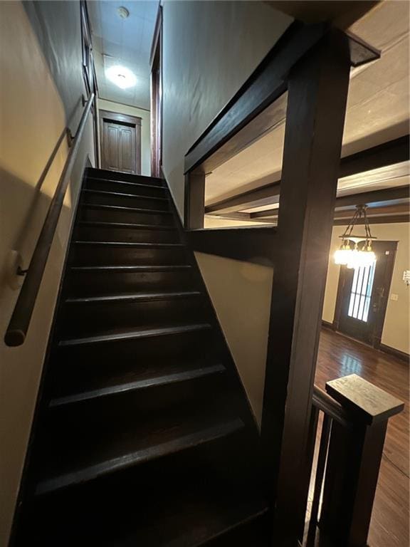 233 Main St, Osawatomie, KS 66064 - stairway featuring wood finished floors