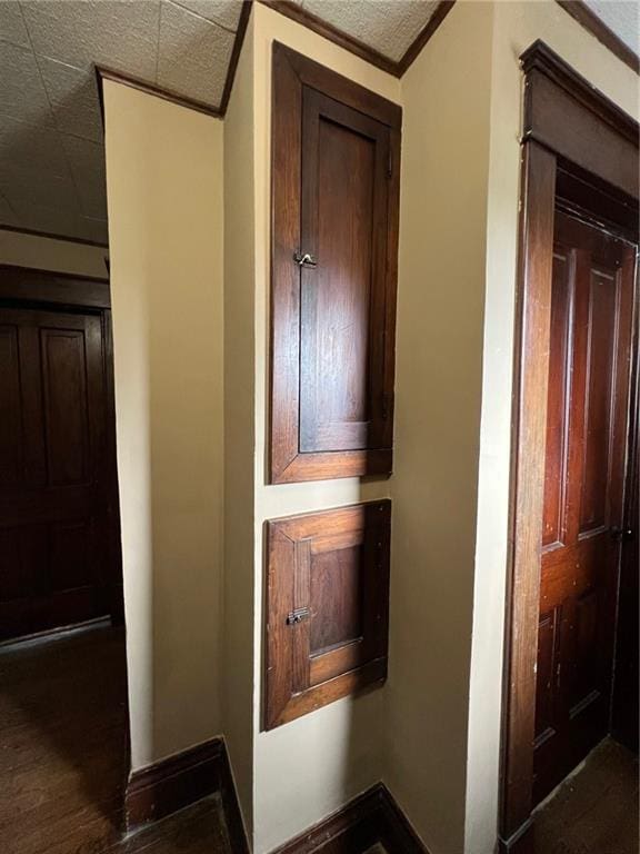 233 Main St, Osawatomie, KS 66064 - hall with baseboards and dark wood-style flooring