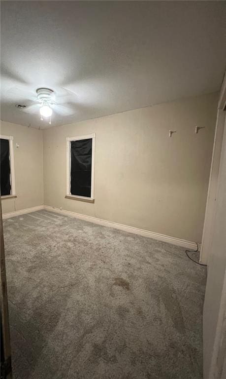 233 Main St, Osawatomie, KS 66064 - empty room featuring carpet flooring and ceiling fan