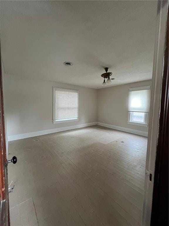 233 Main St, Osawatomie, KS 66064 - empty room featuring baseboards and light wood finished floors