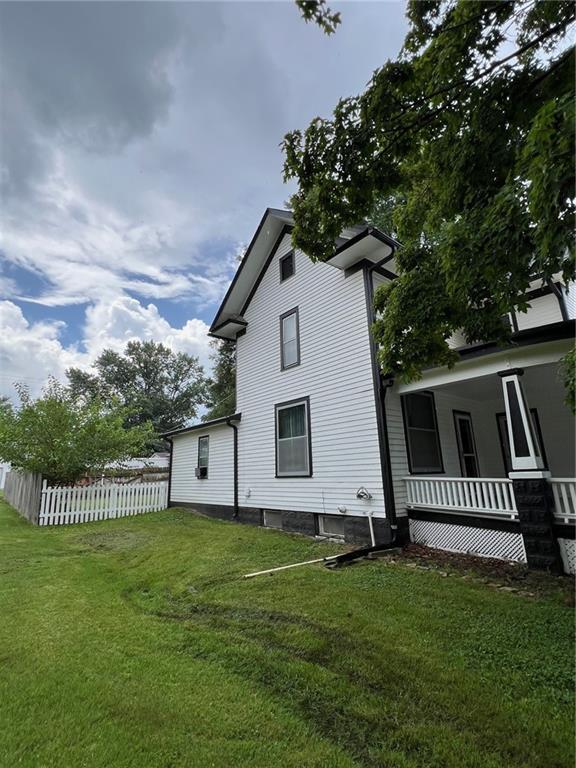 233 Main St, Osawatomie, KS 66064 - view of home's exterior with a porch