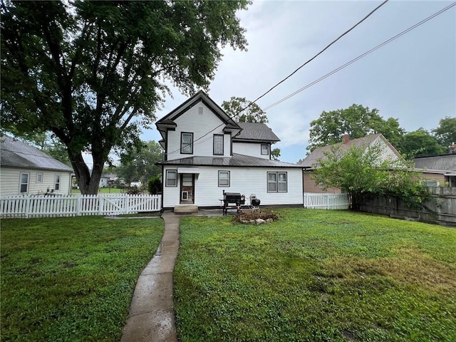 233 Main St, Osawatomie, KS 66064 - back of property with a fenced backyard