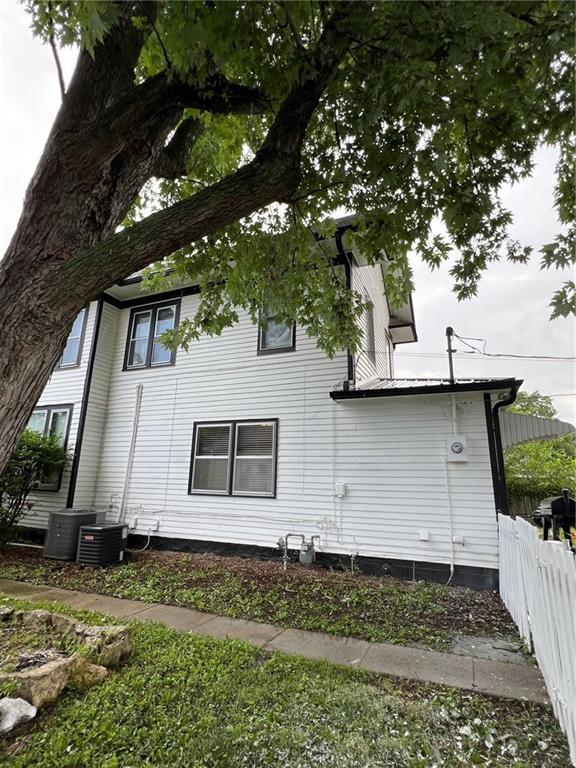233 Main St, Osawatomie, KS 66064 - view of home's exterior with a central air condition unit