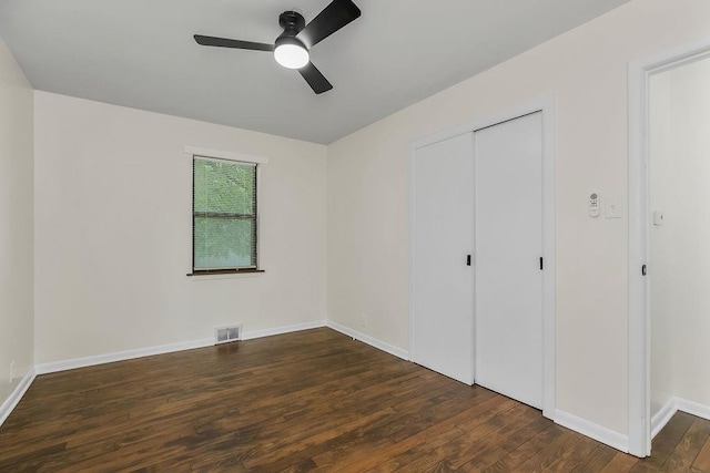 210 S 12th St, Leavenworth, KS 66048 - unfurnished bedroom with wood finished floors, a closet, and a ceiling fan