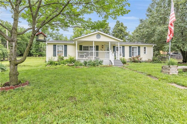 8036 Bellefontaine Ave, Kansas City, MO 64132 - ranch-style house featuring covered porch and a front yard
