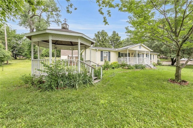 8036 Bellefontaine Ave, Kansas City, MO 64132 - view of front of property with a porch, a front yard, and a gazebo