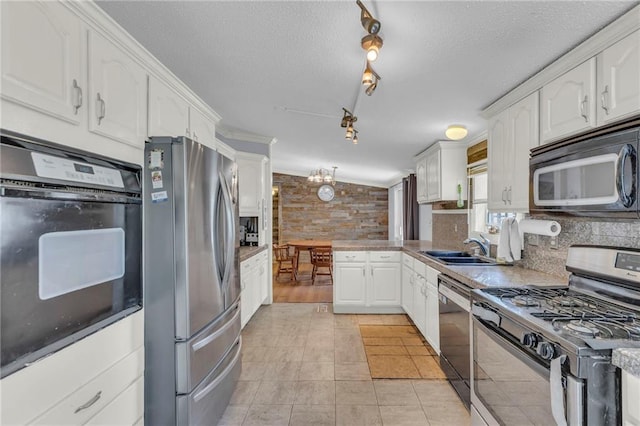 8036 Bellefontaine Ave, Kansas City, MO 64132 - kitchen with black appliances, white cabinetry, a textured ceiling, backsplash, and rail lighting