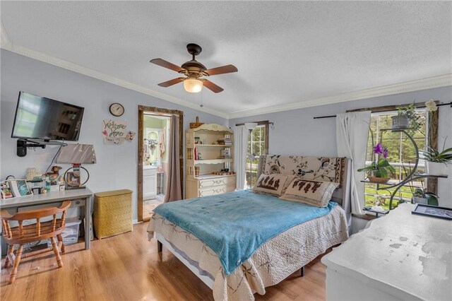 8036 Bellefontaine Ave, Kansas City, MO 64132 - bedroom featuring light wood-style flooring, crown molding, a textured ceiling, connected bathroom, and ceiling fan
