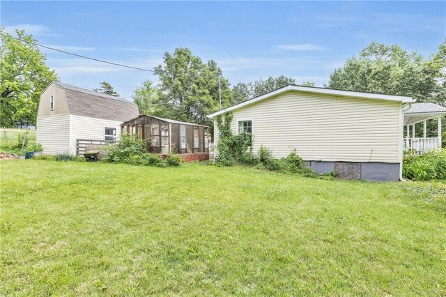 8036 Bellefontaine Ave, Kansas City, MO 64132 - view of green lawn featuring a sunroom