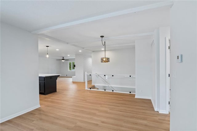 6600 W 93rd Ter, Overland Park, KS 66212 - unfurnished living room with light wood-style floors, beamed ceiling, recessed lighting, and ceiling fan