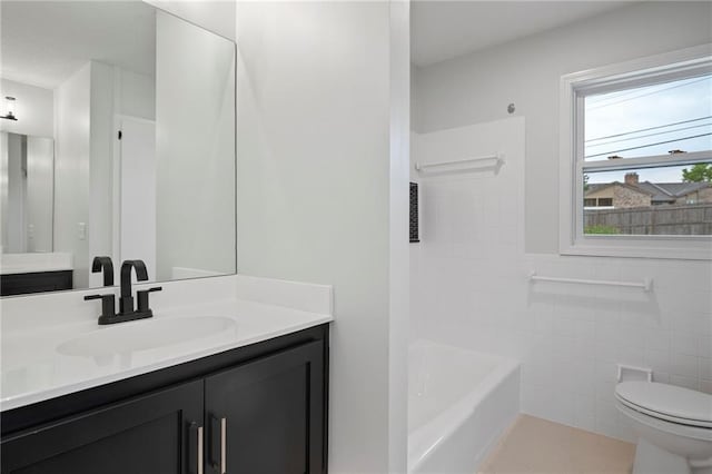 6600 W 93rd Ter, Overland Park, KS 66212 - bathroom with vanity, tile walls, and  shower combination