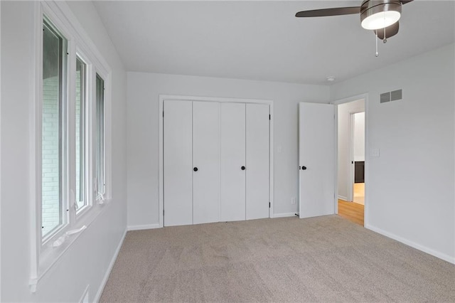 6600 W 93rd Ter, Overland Park, KS 66212 - unfurnished bedroom featuring carpet, a closet, and a ceiling fan