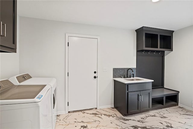 6600 W 93rd Ter, Overland Park, KS 66212 - washroom featuring light marble finish floors, washing machine and clothes dryer, and cabinet space