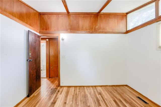 4400 N Brighton Ave, Kansas City, MO 64117 - spare room with light wood-type flooring and baseboards