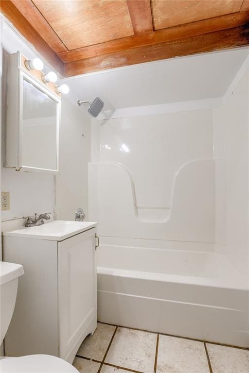 4400 N Brighton Ave, Kansas City, MO 64117 - bathroom with tile patterned floors, vanity, and shower / washtub combination