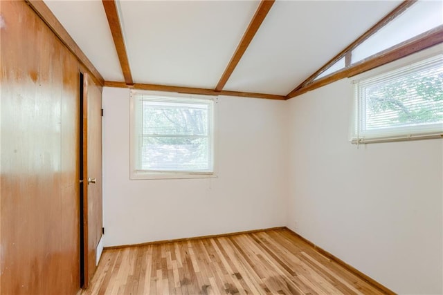 4400 N Brighton Ave, Kansas City, MO 64117 - spare room with light wood-style floors and lofted ceiling