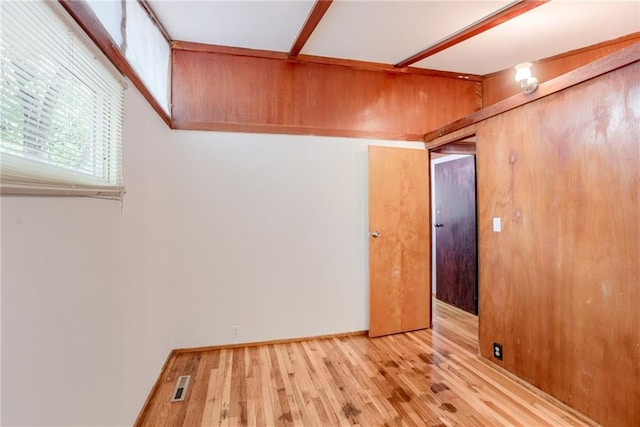 4400 N Brighton Ave, Kansas City, MO 64117 - unfurnished room with wood finished floors