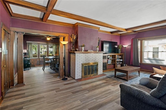 508 S Elm St, Ottawa, KS 66067 - living room featuring coffered ceiling, beam ceiling, wood finished floors, and a fireplace